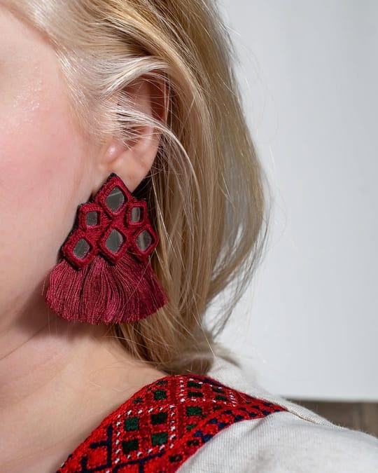 Red mirror work earring with a full red tassel