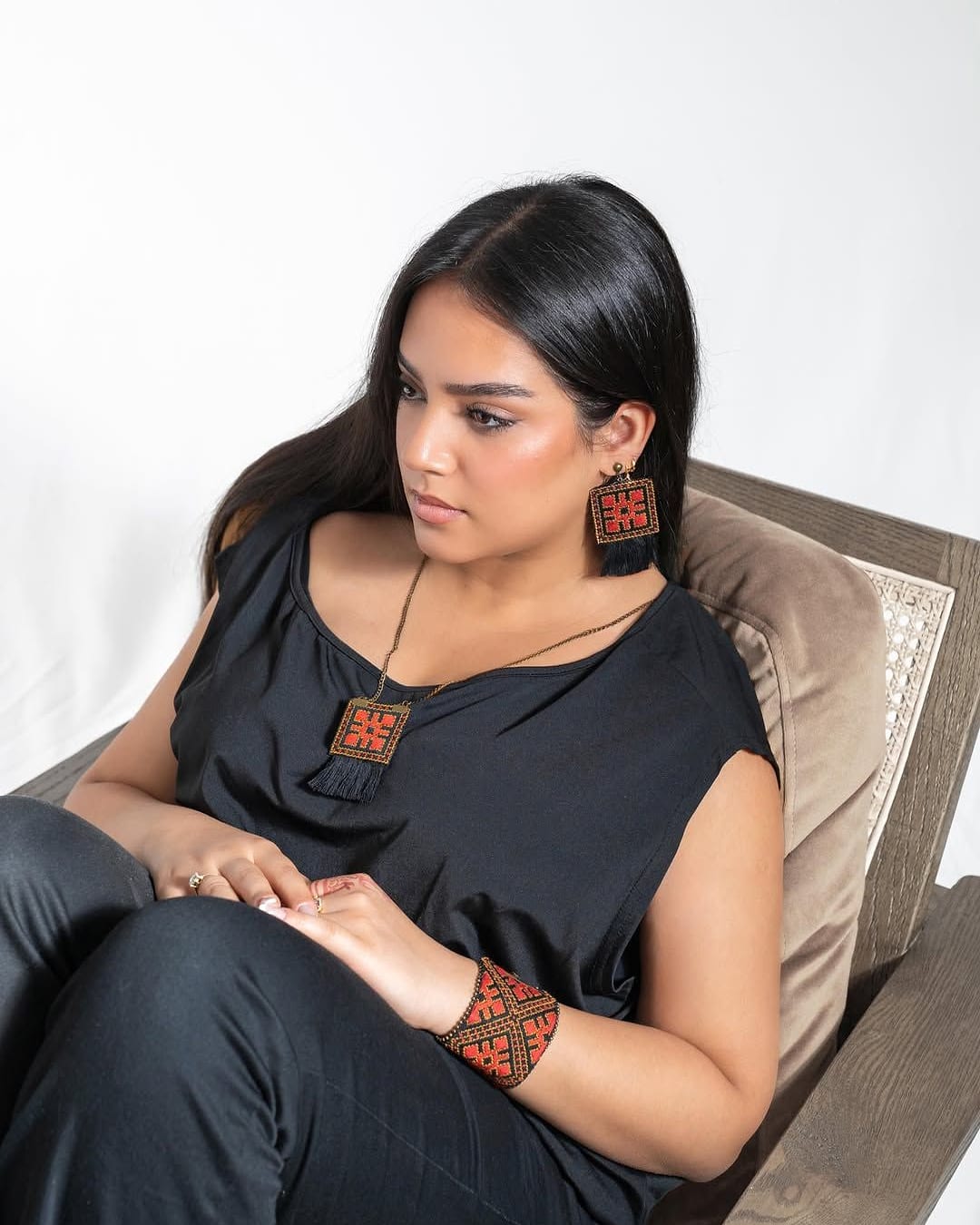 Model in black wearing the Desert Queen embroidered cuff, necklace and earrings