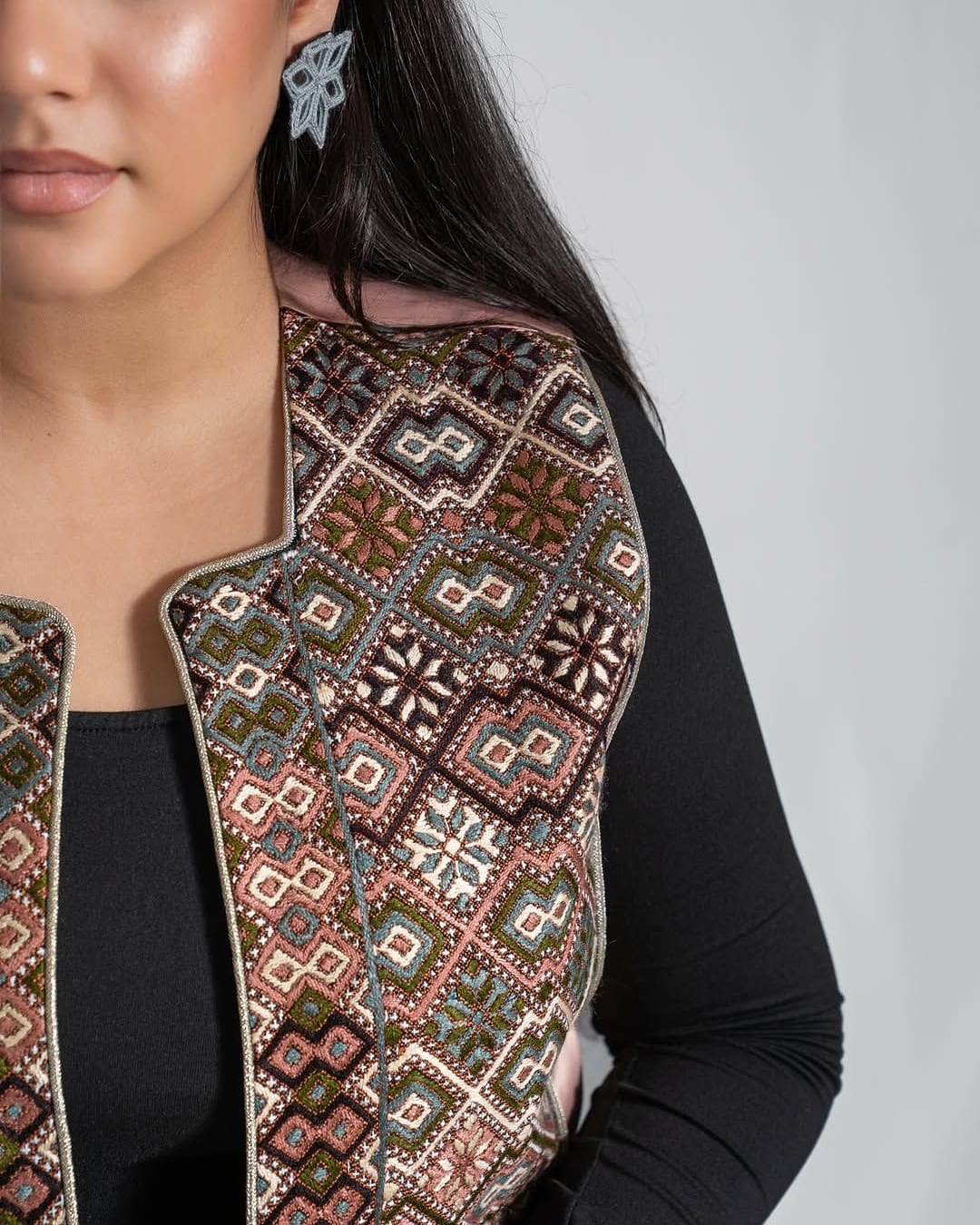 Close view of the geometric embroidery on the front of The Heirloom Vest