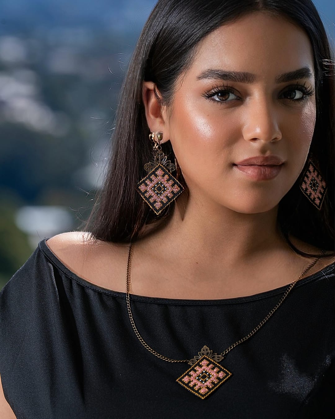 Model wearing the Luna embroidered necklace and matching earrings